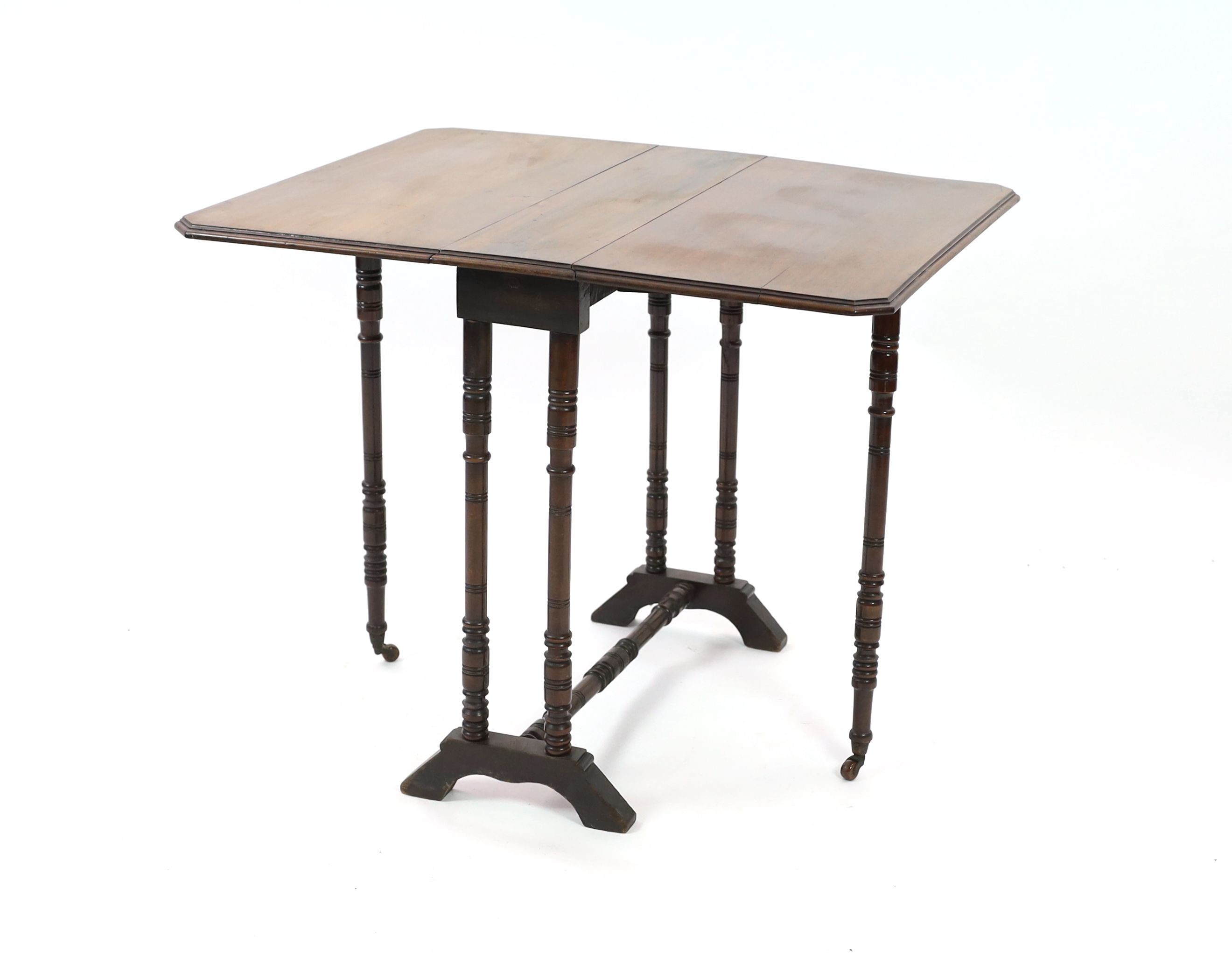 A late Victorian walnut Sutherland table, width 68cm depth 18cm height 69cm